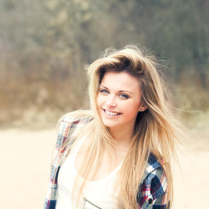A lady smiling after clear invisalign in Oatley, NSW.