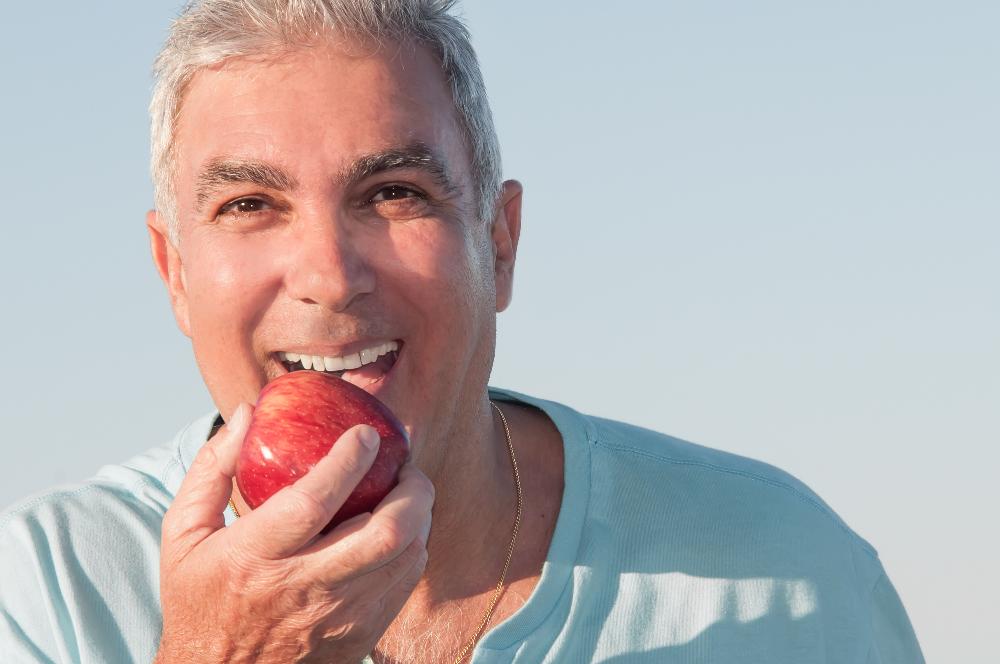 A gentleman eating an apple in Oatley, NSW.