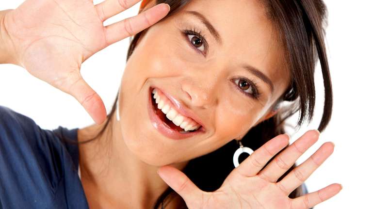 Lady smiling after getting dental implants from CFS Dental