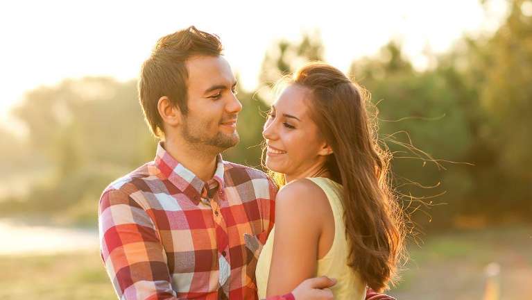 A couple smiling after dental restoration in Oatly, NSW.