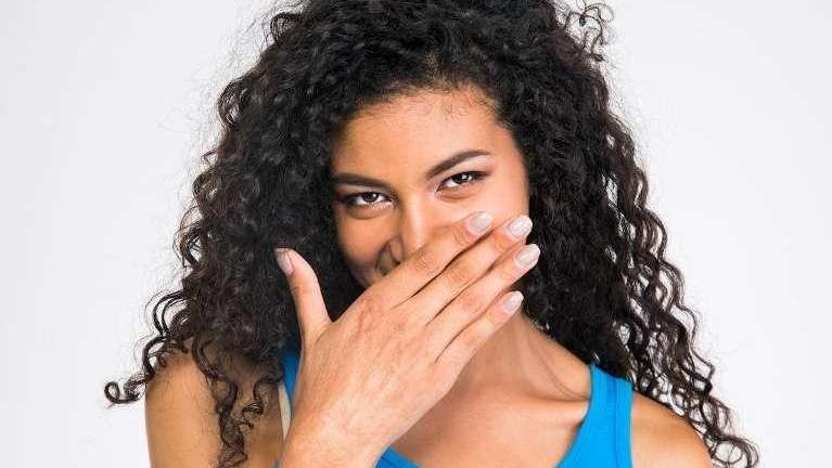 Lady covering her mouth in Oatley