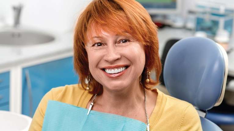 A lady smiling after teeth whitening in Oatley, NSW.