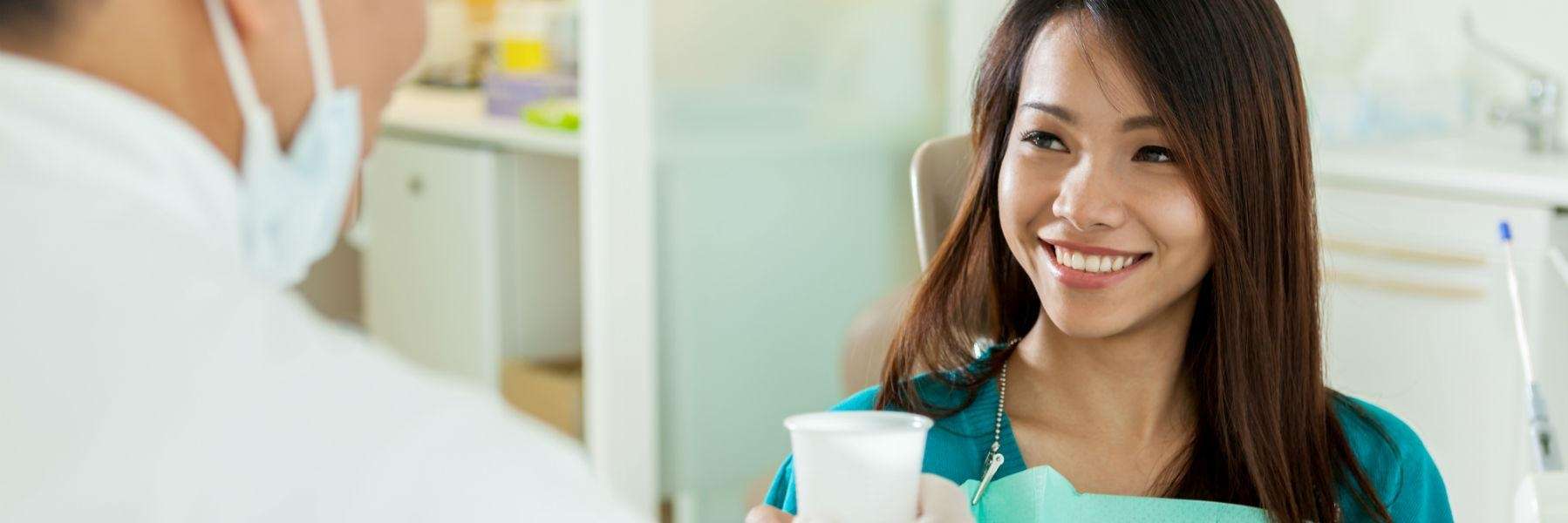 Lady smiling at the dentist after treatment at CFS Dental