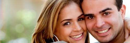 Couple smiling after cosmetic dentistry session in Oatley, NSW